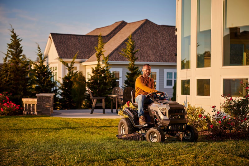 Man on a Briggs and Stratton PXi-Powered Murray Riding Lawn Mower